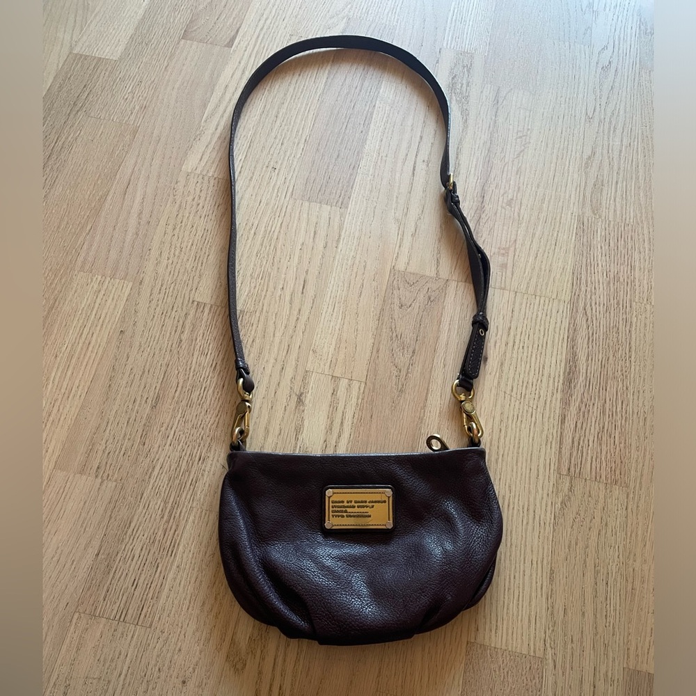 Dark plum Marc by Marc Jacobs leather crossbody bag with gold hardware.